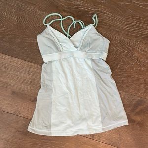 Lulu sport tank with built in bra and cross back in a light sea foam color